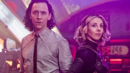 Loki and Sylvie stand next to each other, looking out in a promo image for Loki