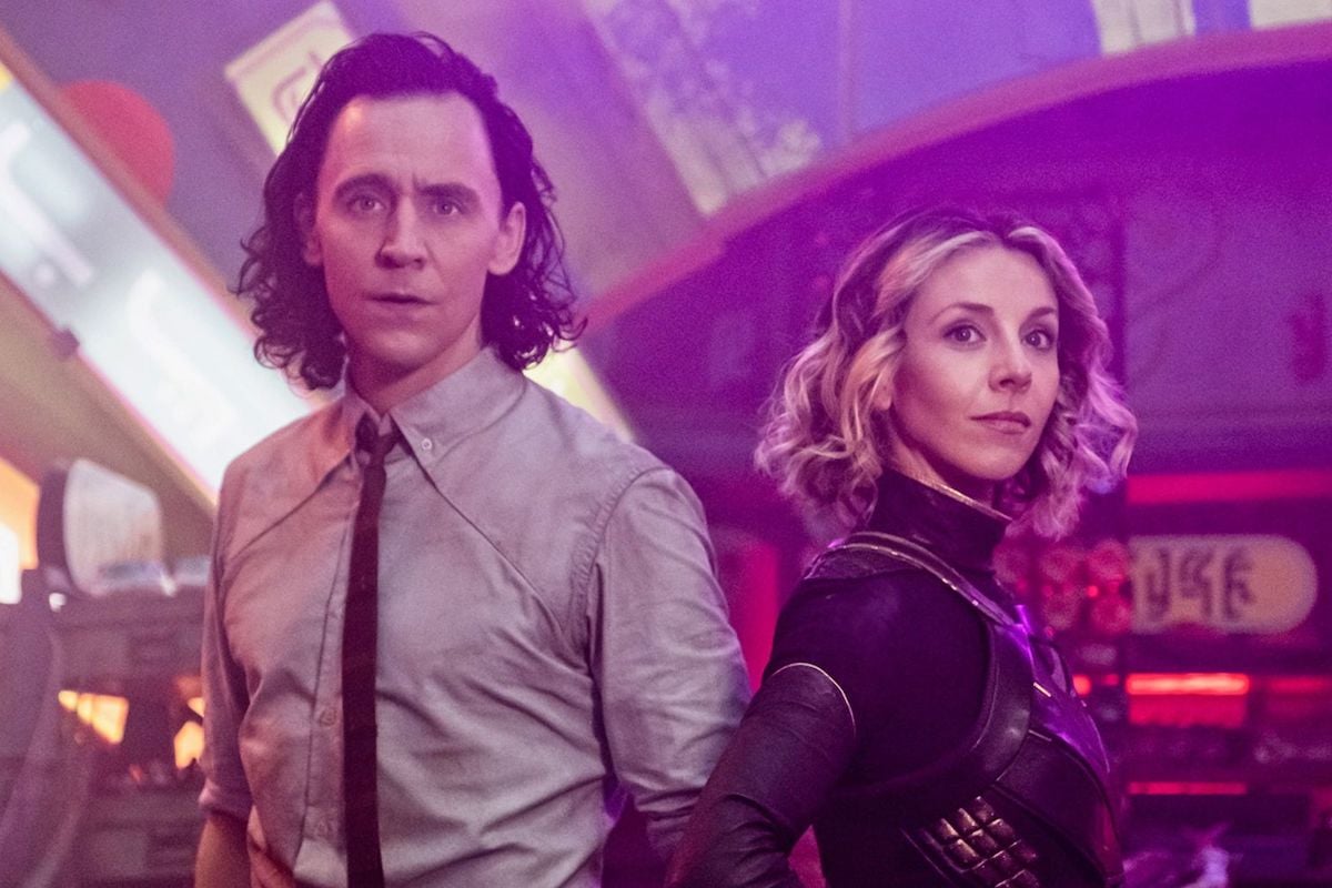 Loki and Sylvie stand next to each other, looking out in a promo image for Loki