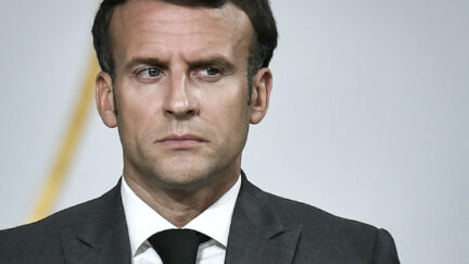 Emmanuel Macron makes a stern face.