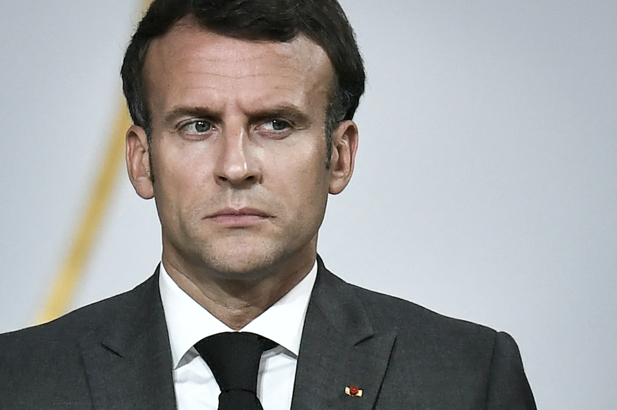 Emmanuel Macron makes a stern face.