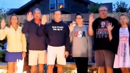 Michael Flynn and five members of his family stand outside, raising their right hands as they repeat an oath.
