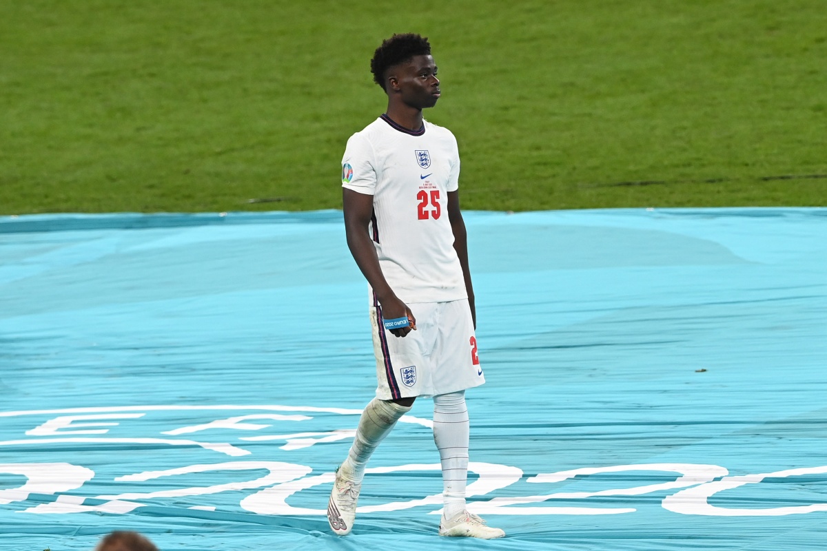 ONDON, ENGLAND - JULY 11: Bukayo Saka of England looks dejected after receiving his runners up medal following defeat in the UEFA Euro 2020 Championship Final between Italy and England at Wembley Stadium on July 11, 2021 in London, England. (Photo by Facundo Arrizabalaga - Pool/Getty Images)