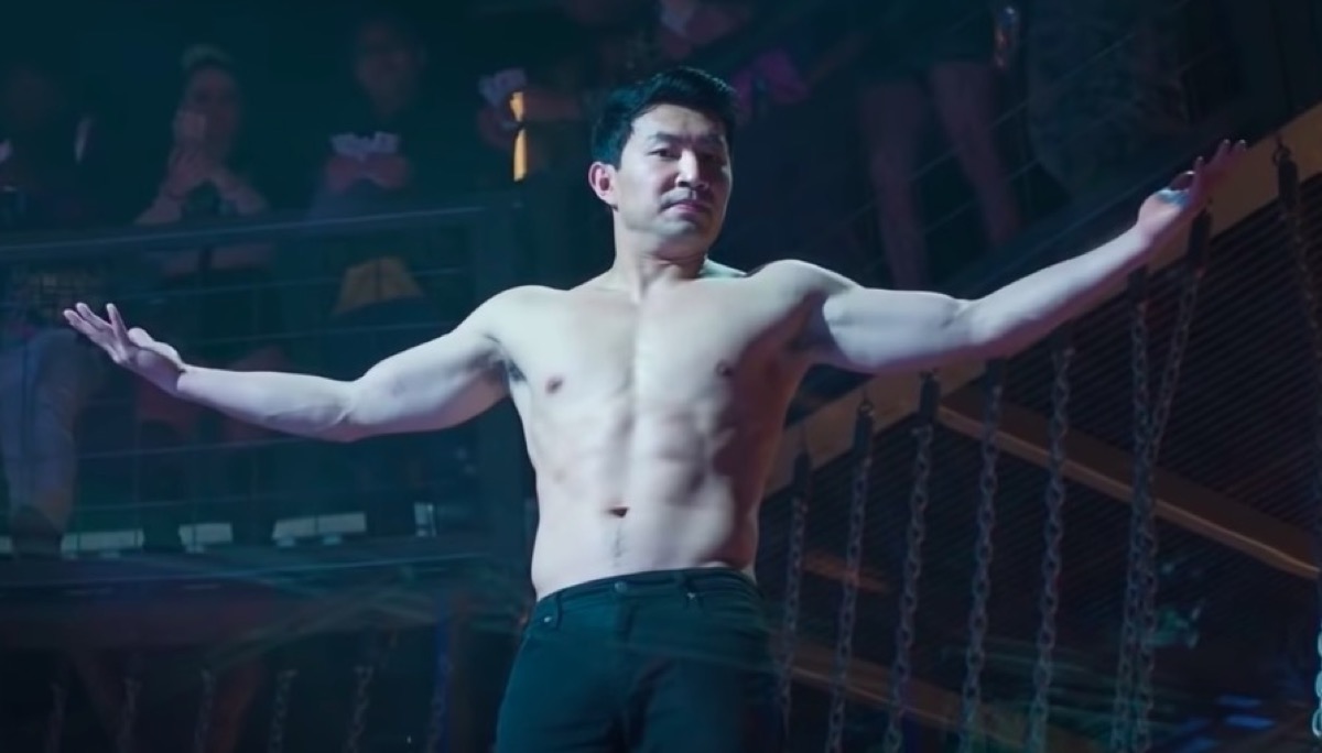 Simu Liu shirtless, shrugging as Marvel's Shang-Chi.