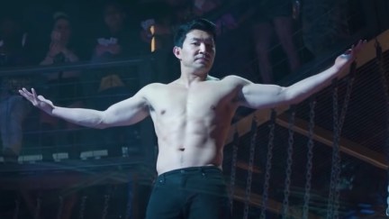 Simu Liu shirtless, shrugging as Marvel's Shang-Chi.