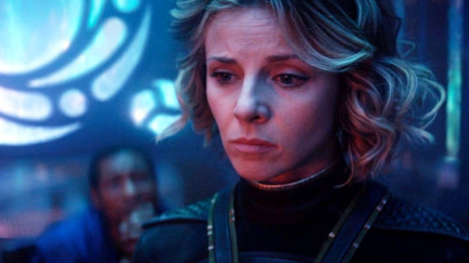 Sophia Di Martino as Sylvie and Jonathan Majors as He Who Remains in the background on 'Loki'