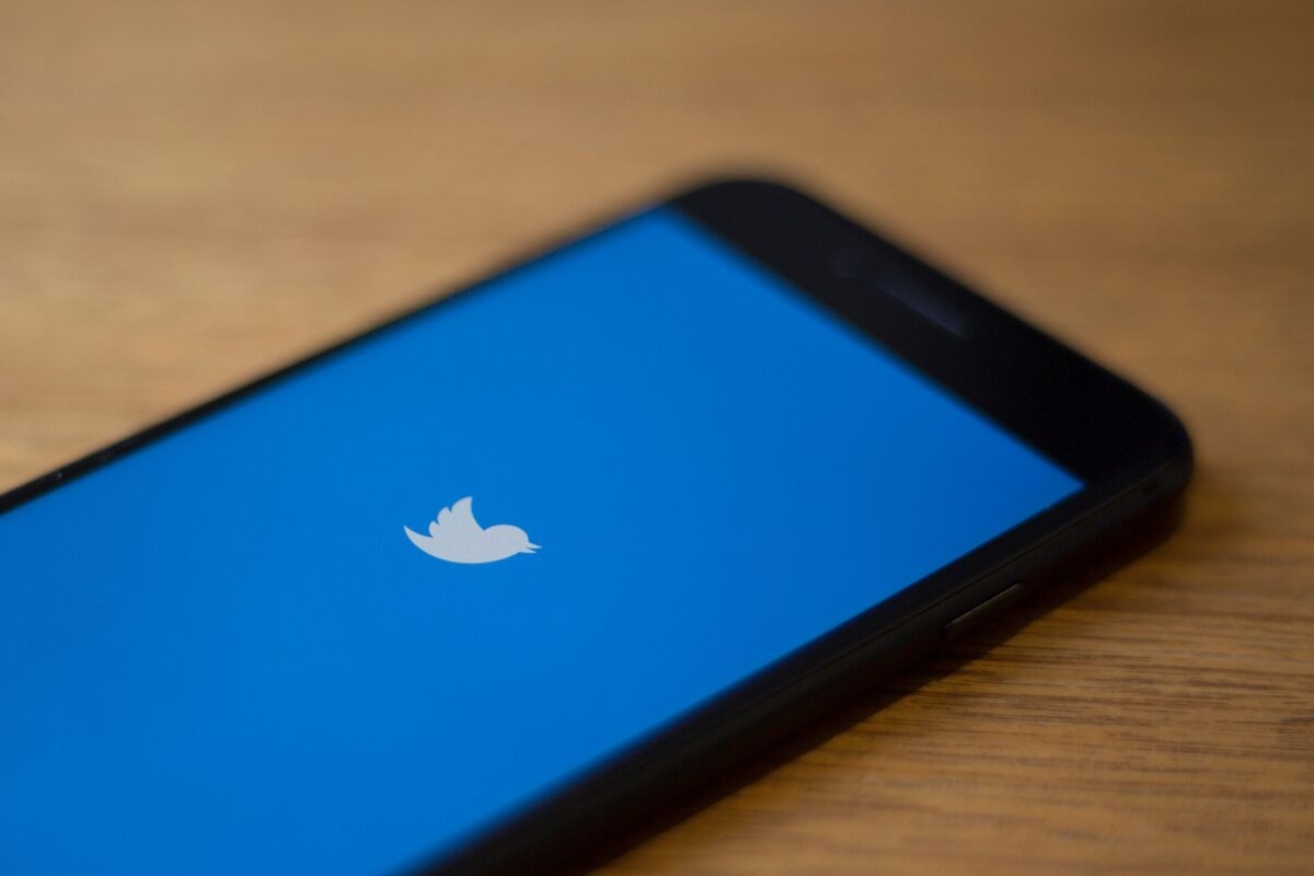 The Twitter logo is seen on a phone in this photo illustration in Washington, DC, on July 10, 2019. - Twitter is moving to filter out inappropriate content based on religion as part of its effort to curb hate speech. In a policy update on July 9, 2019, Twitter said it would take down "dehumanizing language" that targets specific religious groups.Examples shown by Twitter that would be removed would be description of a members of a religion as "disgusting" or "filthy animals." (Photo by Alastair Pike / AFP) (Photo credit should read ALASTAIR PIKE/AFP via Getty Images)