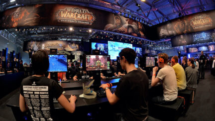Visitors play World of Warcraft at a video game trade fair