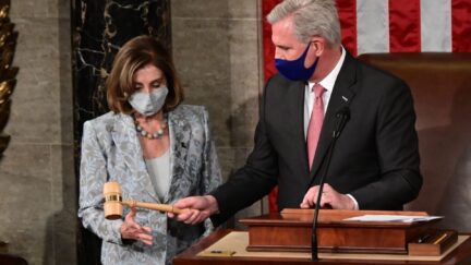 US Speaker of the House Nancy Pelosi is handed the Speaker's gavel by House Minority Leader Kevin McCarthy.