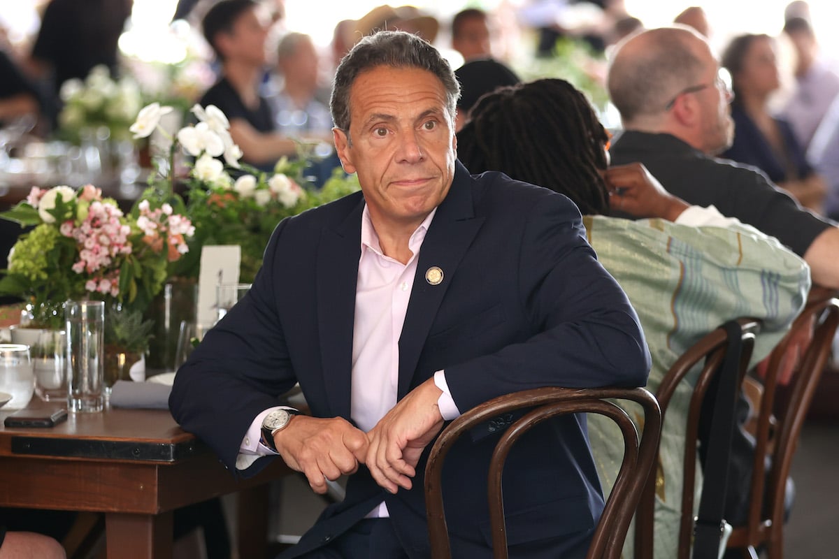 Andrew Cuomo sits at a dinner table at the Tribeca Film Festival