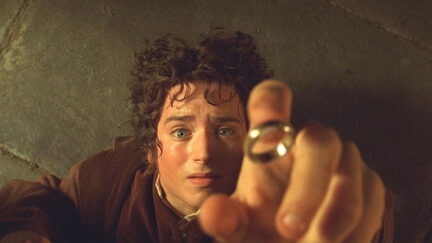 Elijah Wood as Frodo Baggins reaches for the One Ring in Lord of the Rings: The Fellowship of the Rings