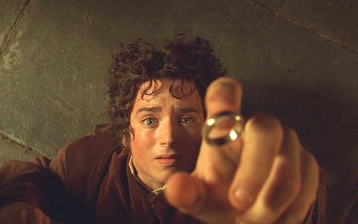 Elijah Wood as Frodo Baggins reaches for the One Ring in Lord of the Rings: The Fellowship of the Rings