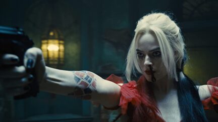Margot Robbie in The Suicide Squad (2021) as Harley Quinn with a gun and serving looks