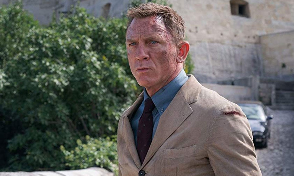 Daniel Craig with soot on his face as James Bond in the movie 'No Time To Die'