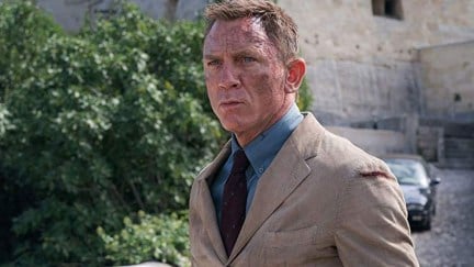 Daniel Craig with soot on his face as James Bond in the movie 'No Time To Die'