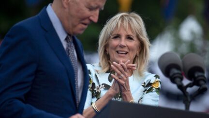 US First Lady Jill Biden (R) listens while US President Joe Biden speaks