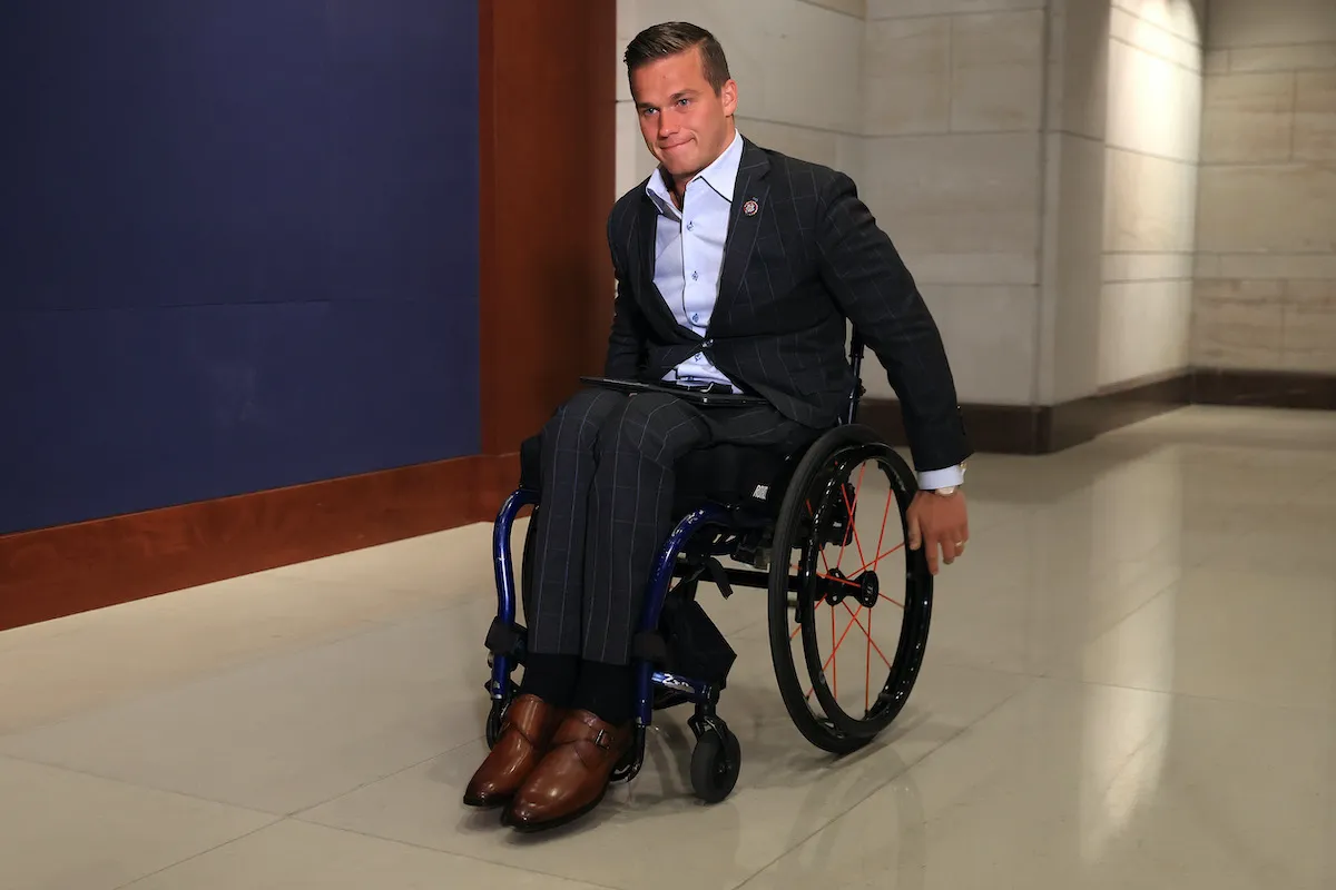 Madison Cawthorn in his wheelchair in a hallway of the Capitol