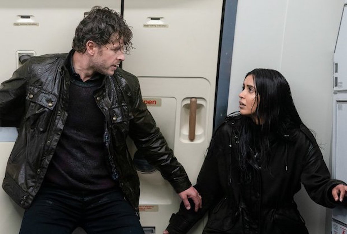 Josh Dallas and Parveen Kaur as Ben and Saanvi soaked on a plane on 'Manifest'