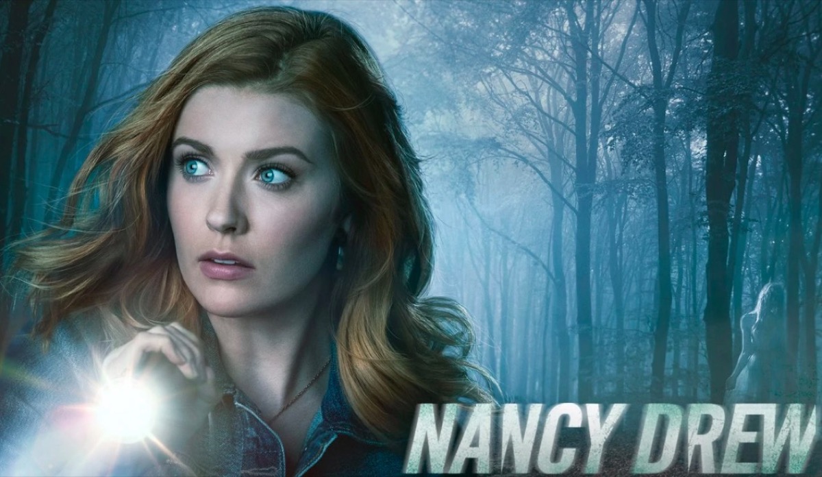 Nancy in the woods with a flashlight in The CW's Nancy Drew banner art.