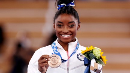 TOKYO, JAPAN - AUGUST 03: Simone Biles of Team United States poses with the bronze medal during the Women's Balance Beam Final medal ceremony on day eleven of the Tokyo 2020 Olympic Games at Ariake Gymnastics Centre on August 03, 2021 in Tokyo, Japan. (Photo by Jamie Squire/Getty Images)
