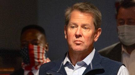 Brian Kemp speaks at a news conference