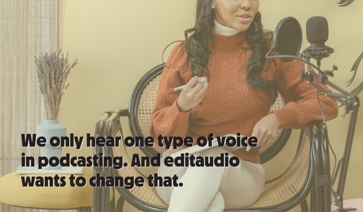A woman sitting at a podcasting mic