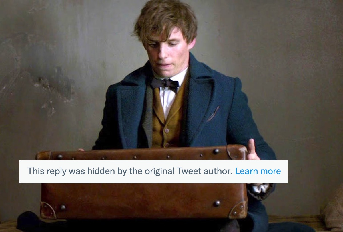 Eddie Redmayne as Newt Scamander in 'Fantastic Beasts and Where to Find Them' looks at a suitcase. A text box is superimposed about hidden replies on twitter.