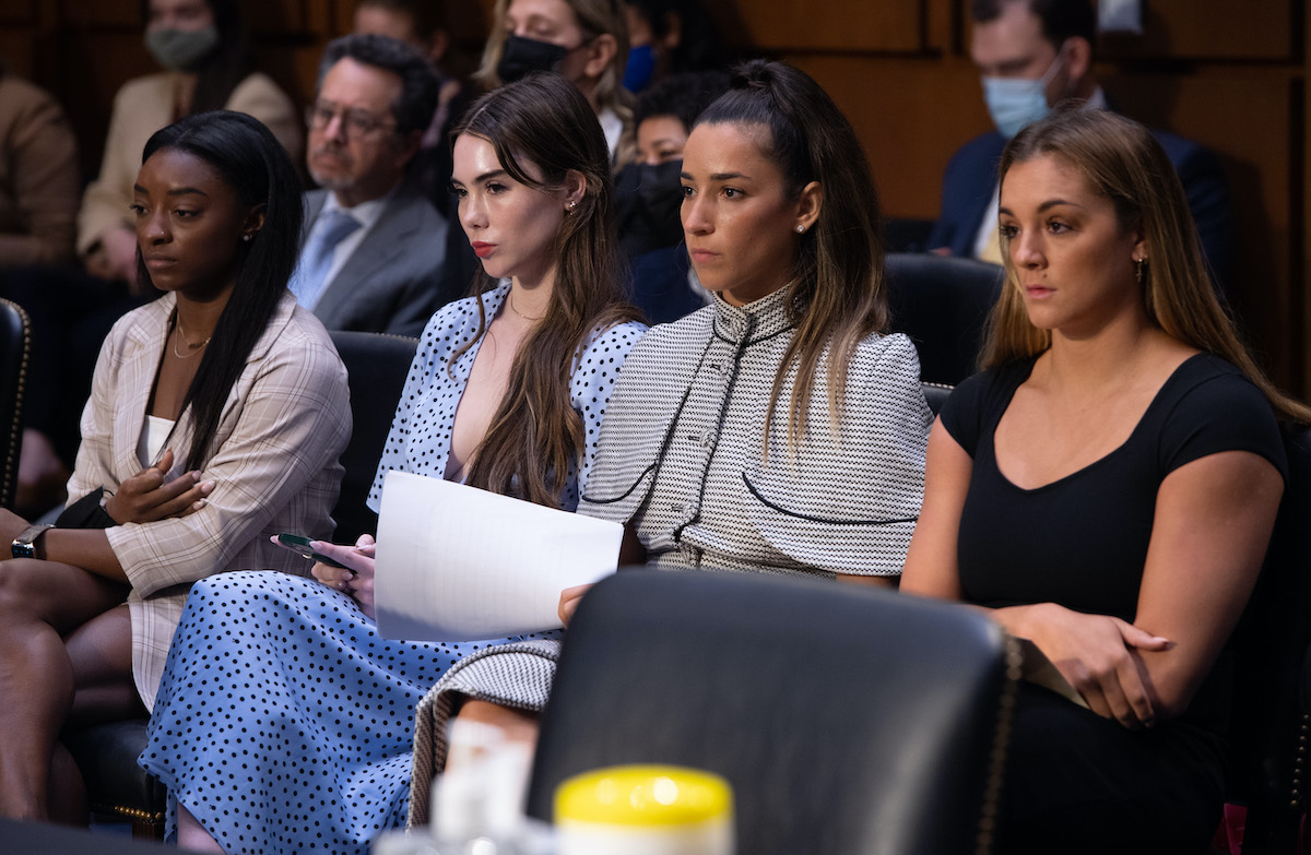 US gymnasts (L-R) Simone Biles, McKayla Maroney, Aly Raisman and Maggie Nichols sit next to each other before testifying during a Senate Judiciary hearing