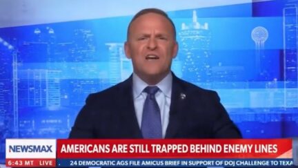 Newsmax host Grant Stinchfield yells on air.