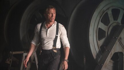 Daniel Craig wearing suspenders and looking too good, frankly, in No Time to Die