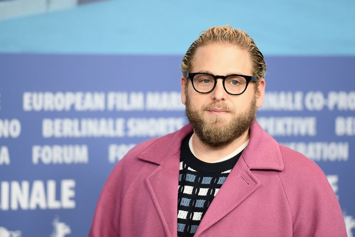 Jonah Hill in a pink jacket at a premiere
