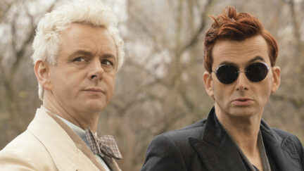Michael Sheen as the angel Aziraphale sits next to David Tennant in sunglasses as the demon Crowley in 'Good Omens'