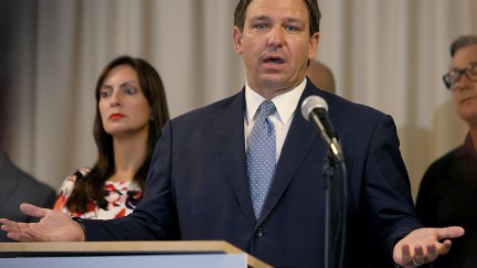 Ron DeSantis gestures while speaking during a press conference.