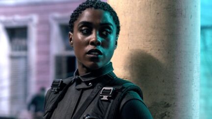Lashana Lynch as Nomi standing against a pillar in No Time To Die