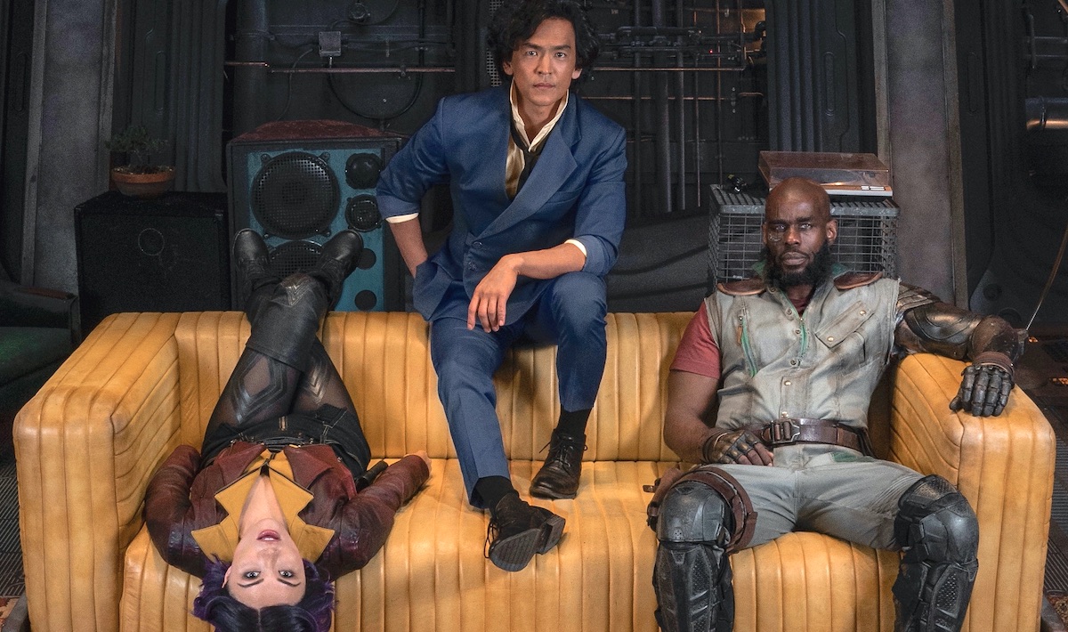 The main cast of Netflix's live-action Cowboy Bebop series lounges on a yellow couch