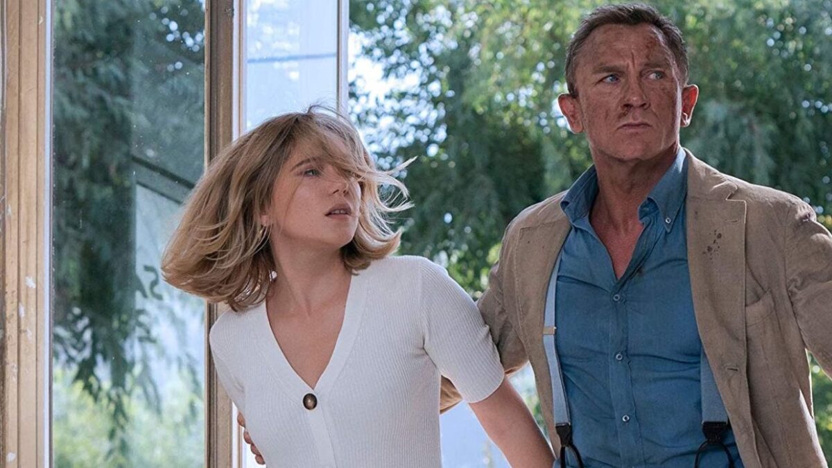 Daniel Craig as Bond grabs Lea Seydoux as Madeleine's arm in 'No Time to Die'