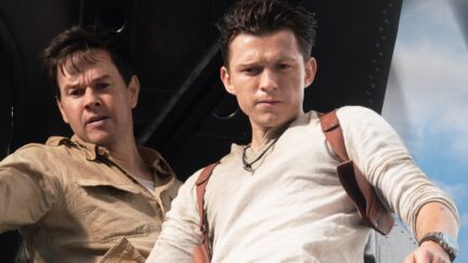 Tom Holland and Mark Wahlburg standing on a plane in Uncharted
