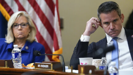 Rep. Liz Cheney, R-Wyo., and Rep. Adam Kinzinger, R-Ill., listen during a committee hearing.