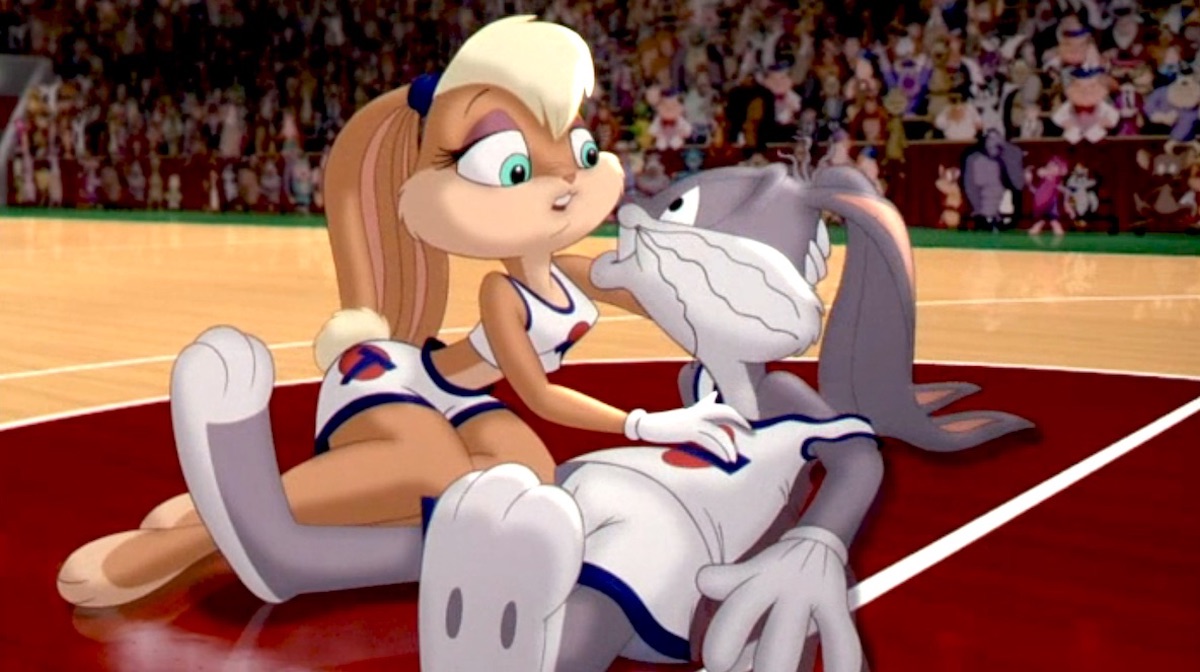 Bugs Bunny lies in Lola Bunny's arms on the basketball court in Space Jam