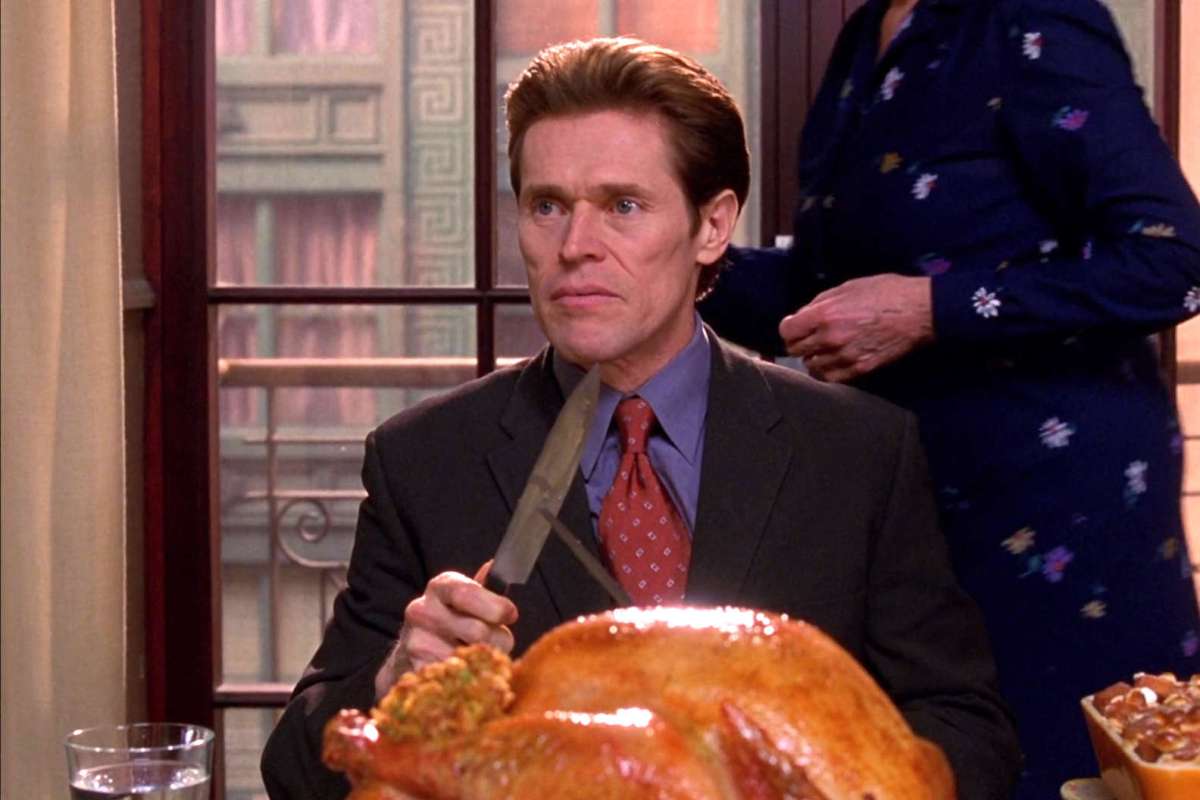 Willem Dafoe as Norman Osborn carving a turkey