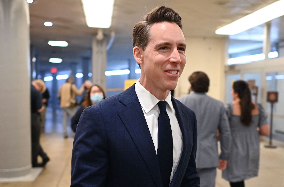 Josh Hawley gives a rat-faced smile