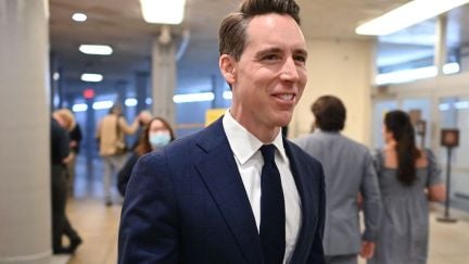 Josh Hawley gives a rat-faced smile