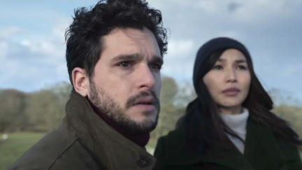 Kit Harington staring into the open with Gemma Chan in Eternals