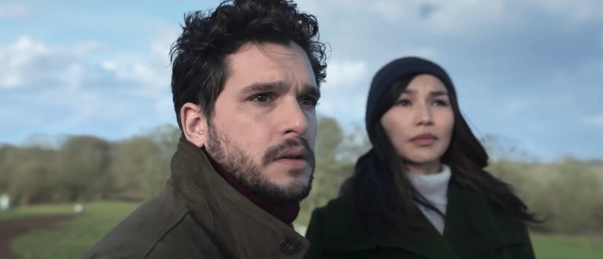 Kit Harington staring into the open with Gemma Chan in Eternals