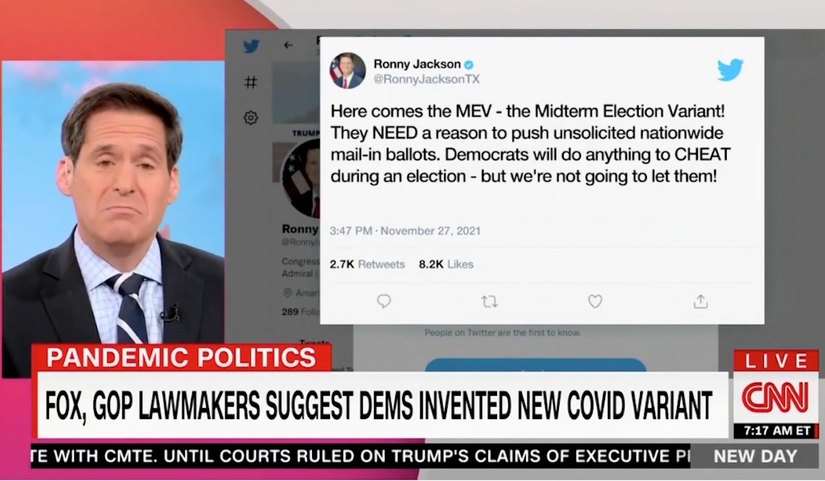 A CNN host next to an image of a tweet above a chyron about a COVID conspiracy theory