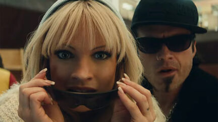 Lily James and Sebastian Stan looking into the camera as Pam and tommy