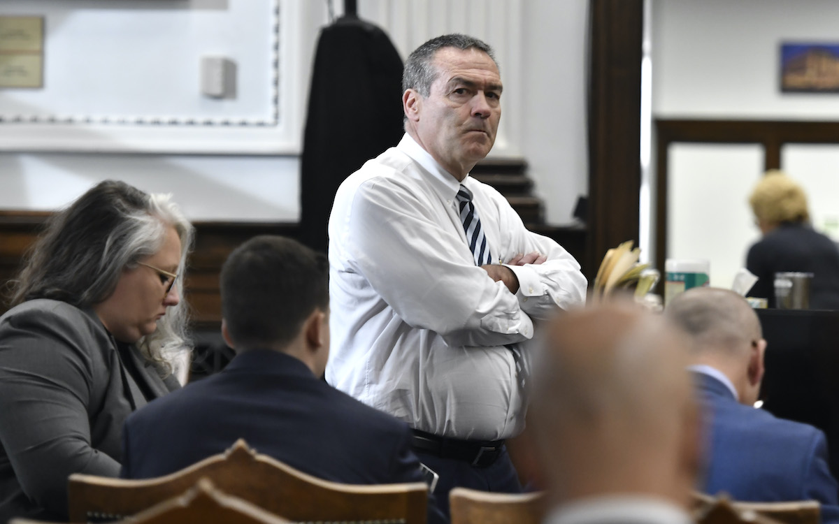 Mark Richards, Kyle Rittenhouse's lead attorney, center, stands in from of his team in court.