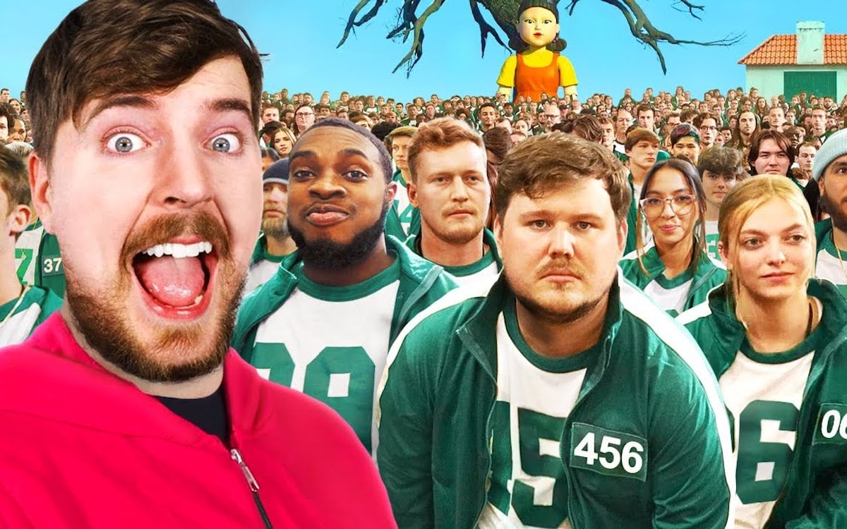 YouTuber MrBeast poses in front of a crowd of people dressed in green jumpsuits like characters from Squid Game