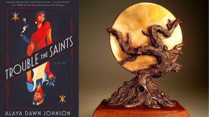 Best Novel winner next to the statue for WFA winners. (Image: Tor Books and World Fantasy Awards Administration.)