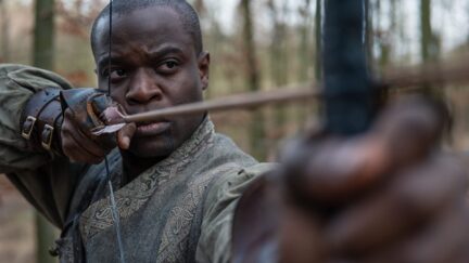 An archer drawing a bow in Amazon's Wheel of Time.