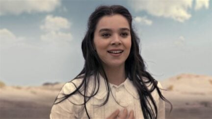 Hailee Steinfeld as Emily Dickinson wearing a white dress in Apple TV+'s Dickinson.